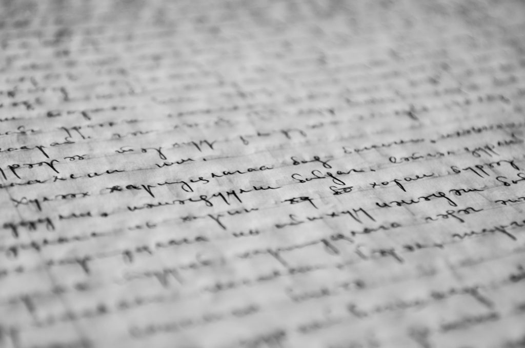 An image of some old script to represent JAvascript.