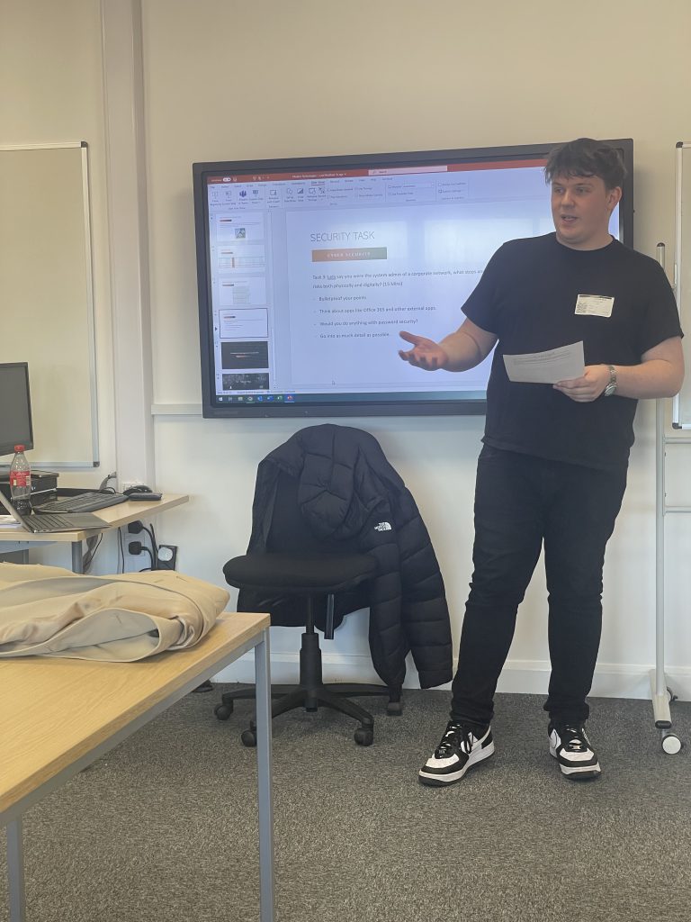 Curtis Holt delivering a "security task" in the classroom.