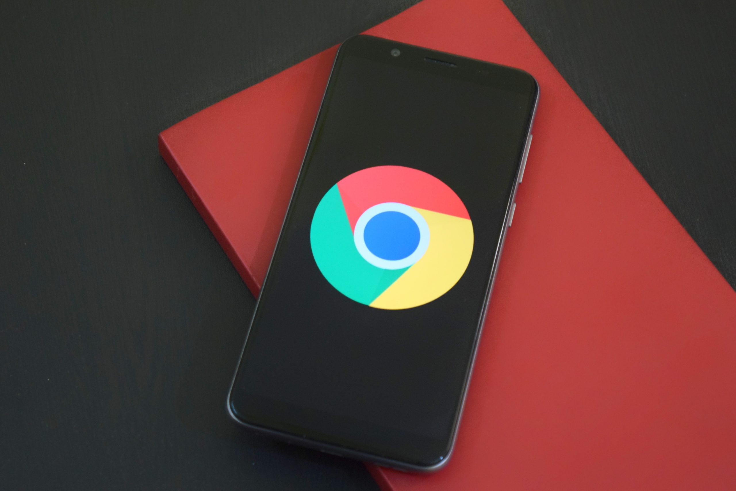An image of a phone with the Google Chrome logo.