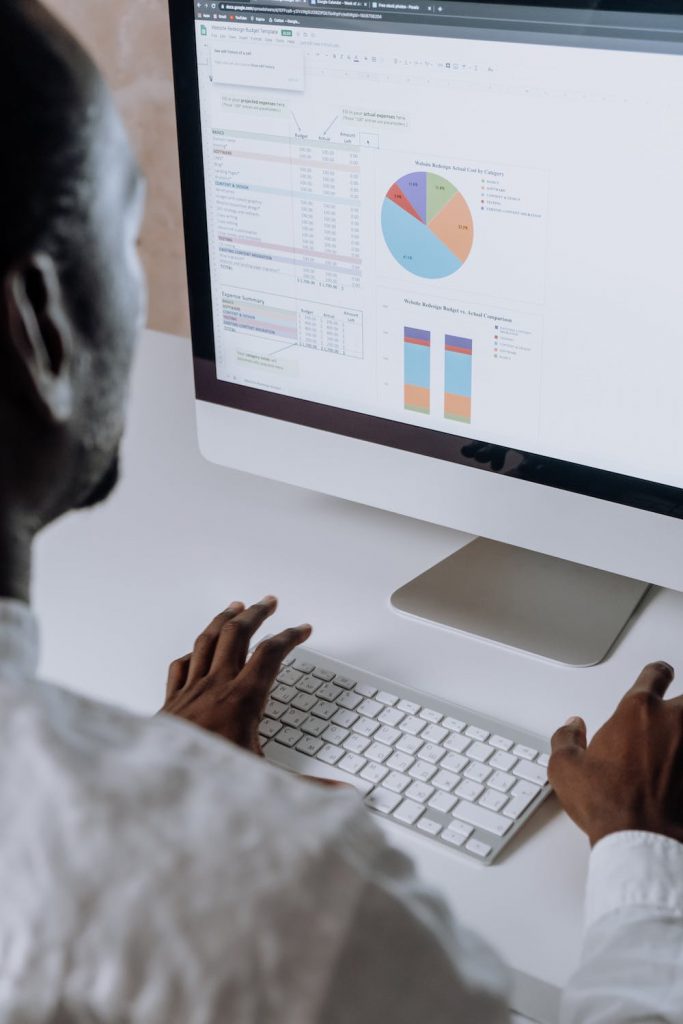 A man using analytics software to interpret graphs